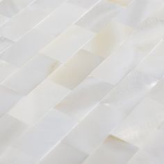 a close up view of white marble tiles