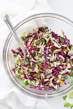 a glass bowl filled with coleslaw slaw