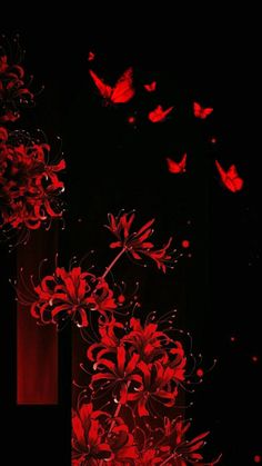 red flowers and butterflies flying in the dark