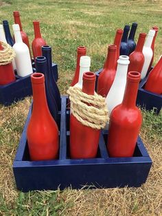 red, white and blue bottles are in a crate