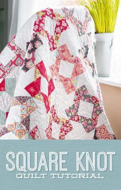 the square knot quilt pattern is shown in front of a window and vase with flowers