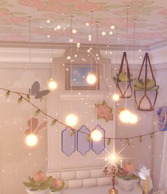 the lights are hanging from the ceiling in the room with flowers and butterflies on it