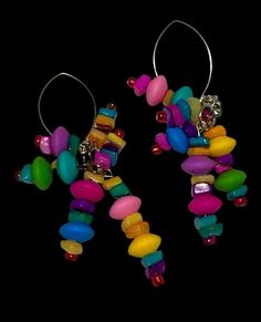 Brightly colored Marquis earrings, hand beaded with a rainbow of bead clusters. Fun and flirty, these unique earrings make a bold statement for anyone. Multicolor Whimsical Earrings, Rainbow Party Jewelry With Dangling Beads, Handmade Rainbow Beaded Earrings For Party, Unique Multicolor Large Beads Earrings, Unique Multicolor Earrings With Large Beads, Party Dangle Earrings With Large Beads, Party Large Beaded Dangle Earrings, Vibrant Rainbow Dangle Earrings, Playful Multicolor Beaded Earrings