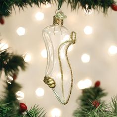 a glass ornament hanging from a christmas tree