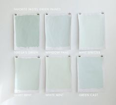 six different shades of green paint on a white wall