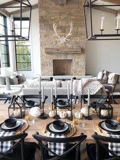 an instagram photo of a dining room table with black and white place settings