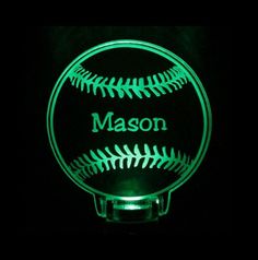 a baseball shaped light up with the name mason on it