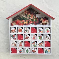 a house shaped clock with christmas decorations on it