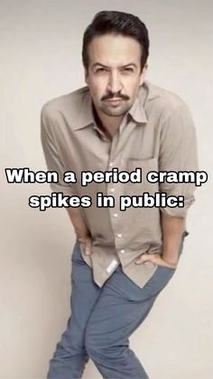 a man standing in front of a white wall with the caption when a period cramps spikes in public