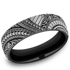 a black and white wedding band with an intricate design