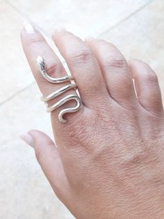 Model : Classic Snake Ring Collection: Ofis Brass/ gold-plated Handcrafted in Greece Adjustable size - open from behind for your convenience ++ IN STOCK READY FOR IMMEDIATE SHIPMENT: 1 pcs GOLD-PLATED size: 5 1/4 (US) 1 pcs GOLD-PLATED size: 5 3/4 (US) 2 pcs GOLD-PLATED size: 6 3/4 (US) 1 pcs GOLD-PLATED size: 7 (US) 1 pcs GOLD-PLATED size: 7 3/4 (US) 2 pcs GOLD-PLATED size: 8 (US) 1 pcs GOLD-PLATED size: 9 (US) 1 pcs GOLD-PLATED size: 9 1/4 (US) 1 pcs GOLD-PLATED size: 9 1/2 (US) 1 pcs GOLD-PLA Adjustable Snake Symbolic Ring, Adjustable Snake-shaped Symbolic Rings, Adjustable Symbolic Snake Ring, Adjustable Snake Shape Promise Ring, Elegant Handmade Snake Ring With Open Design, Unique Sterling Silver Snake Ring, Elegant Handmade Snake Ring With Open Shape, Unique Adjustable Snake Ring For Anniversary, Unique Hand Forged Snake Ring