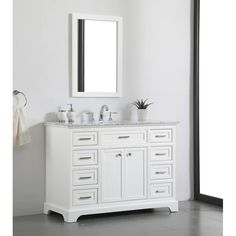 a white bathroom vanity with two sinks and a mirror