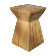 a small wooden stool sitting on top of a white floor