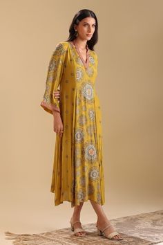 Yellow dress with geometric print and sequin, bead embroidery. - Aza Fashions Fitted V-neck Dress With Mirror Work, Festive V-neck Printed Dresses, Yellow V-neck Dress For Festive Occasions, Yellow V-neck Festive Dress, Festive Yellow V-neck Dress, Elegant Yellow Dress With Printed Motifs, Festive Floor-length Printed Dresses, Summer Anarkali Dress With Sequins, Yellow Long Sleeve Dress With Mirror Work