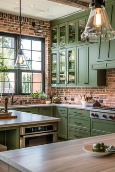 a kitchen with brick walls and green cabinets