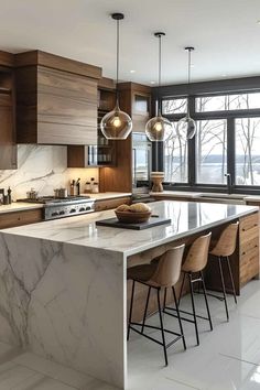 a large kitchen with marble counter tops and wooden cabinetry, along with bar stools