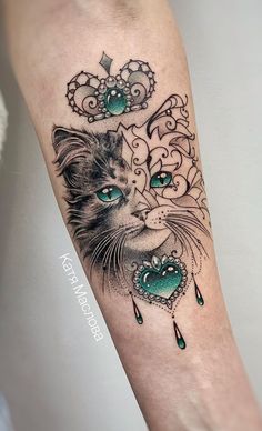 a cat with blue eyes is shown on the forearm and arm, which has an ornate design