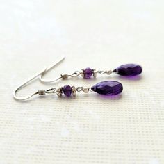 Purple Amethyst faceted flat briolette and micro faceted Purple Amethyst rondelles in sterling silver dangle earrings. Lovely and elegant jewelry made with top quality genuine gemstones in natural color with a lot of sparkle. The length of the dangle is about 1.5 inches and the earrings are lightweight and comfortable. Limited edition jewelry. Amethyst is the birthstone for the month of February. It is a powerful stone of spiritual protection and purification  Thank you for visiting my shop. Lov Sterling Silver Briolette Jewelry With Faceted Beads, Sterling Silver Briolette Faceted Beads Jewelry, Purple Faceted Earrings For Anniversary, Dainty Faceted Briolette Earrings, Dainty Briolette Faceted Earrings, Dainty Faceted Sterling Silver Earrings, Purple Teardrop Crystal Earrings In Sterling Silver, Elegant Sterling Silver Crystal Earrings With Faceted Beads, Elegant Hypoallergenic Amethyst Earrings