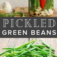 pickled green beans in mason jars on a wooden table