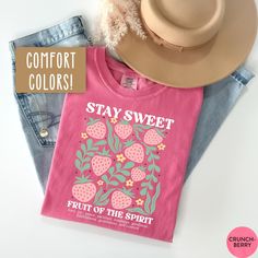 This Fruit of the Spirit Shirt is the perfect trendy Christian t shirt, Christian Merch, and Preppy Jesus Apparel! Our Comfort Colors tees are super soft, DTG printed (printed with ink), and 100% cotton. 🌞 SHOP KIDS' MATCHING SHIRTS BELOW!🌞 https://sunofamother.etsy.com/listing/1763405838/kids-boho-christian-strawberry-shirt ❗❗There may be a slight difference in the colors due to different monitors. ❗❗ 🌞 HOW TO ORDER 🌞 * Select your size and color from the drop-down menu * Add your shirt to cart. If you would like more than one, add each one to cart individually. * Proceed to check out! * Your shirt will be ready to ship in 1-3 days! 🌞 SIZING 🌞 Check the Size Chart and Fit Guide in the photos for reference! 🌞 PRODUCTION + SHIPPING 🌞 * Order Production: 1-3 business days  * Standard Pink Casual Tops With Comfortable Fit, Casual Pink Tops With Comfortable Fit, Casual Pre-shrunk Spring Tops, Pink Pre-shrunk Shirt For Spring, Spring Pink Pre-shrunk Shirt, Casual Spring Shirt With Funny Print, Trendy Pre-shrunk Spring Shirt, Spring Multicolor Printed Shirt, Spring Pink Shirt With Text Print