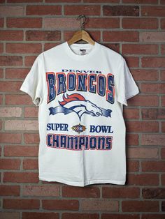 Good condition on this piece from the 90s. Chest (pit to pit) measurements: " Length measurements: " Tag: Oneita Football Merch, Superbowl Champions, Sports Tee, Sport T-shirts, Sports Tees, Denver Broncos, Shirt Ideas, Sport T Shirt, Denver