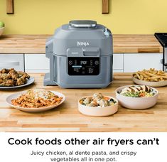 an advertisement for the ninja air fryer is shown with various foods in bowls and plates