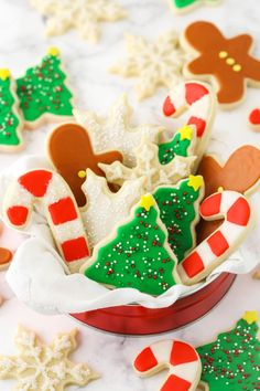 decorated christmas cookies in a bowl on a table