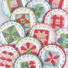 some very cute little patchwork ornaments on a table