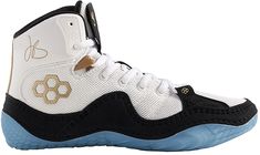 a pair of sneakers with white and black shoes on the bottom, blue soles