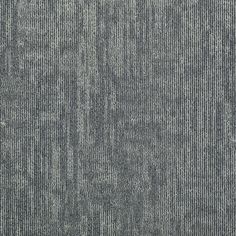 an up close shot of the texture of a carpet with vertical lines in grey and white