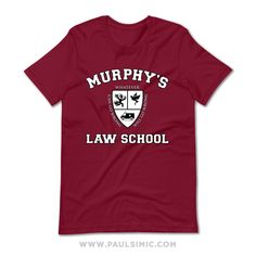 "\" Anything that can go wrong will go wrong \" is the Murphy's Law School motto. This funny shirt design is a spoof of the Harvard Law School logo. by Paul Simic These cool graphic tees come in Crimson, Red, Maroon, Royal Blue, and Heather Grey colors. You can also pick between a Regular T-shirt or Women's tee, Hoodie and Long Sleeve shirt. *The Maroon colored clothing has a Purple hue to it. Not all of the colors are available in particular styles. T-shirt - Regular * 100% Cotton (Heather Grey Funny College T-shirt With Letter Print, Funny Letter Print T-shirt, College Fun School Spirit T-shirt With Funny Text, Funny Pre-shrunk College T-shirt, Murphy Law, Harvard Law, Harvard Law School, School Logo, Crimson Red