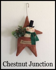 a christmas ornament hanging from the side of a wall