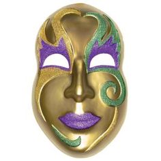 a gold mask with purple and green designs on the face is hanging from a chain