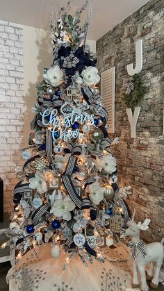 a blue and white christmas tree decorated with ornaments