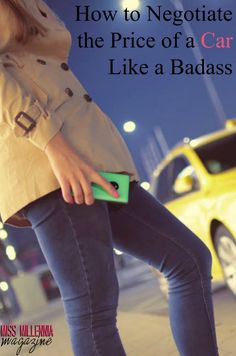 a woman is standing on the sidewalk with her hand in her pocket and holding a green purse