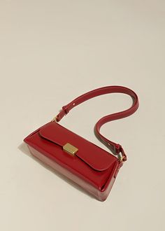 Indulge in sophistication and style with our Red Leather Baguette Shoulder Bag. The flap lock closure and adjustable strap combine practicality with elegance. The structured silhouette and flat base provide stability, while the interior slip pockets enhance organization. Handcrafted with genuine cowhide leather, this women's shoulder bag is the epitome of luxury. Size info 11" (28cm) width 4"(10cm) height 6 3/4"(17cm) depth Details Flap lock closure Adjustable shoulder strap Structured silhouett Timeless Crossbody Baguette Bag For Formal Occasions, Timeless Crossbody Baguette Bag For Formal Events, Square Baguette Bag With Hasp Closure For Office, Classic Baguette Bag With Hasp Closure, Luxury Rectangular Baguette Bag With Adjustable Strap, Classic Business Baguette Shoulder Bag, Sleek Rectangular Flap Bag With Detachable Strap, Classic Leather Baguette Bag With Hasp Closure, Classic Clutch Baguette Bag With Adjustable Strap