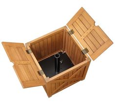 an open wooden box with two doors and a black object in the bottom right corner