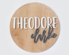 a wooden plaque that says theodore cafe on it's side, with the word