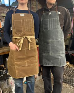 Our signature workshop apron with a removable leather neck strap for easy maintenance. Handmade in our Omaha, NE studio using only the finest materials. Workshop Apron, Shop Apron, Sustainable Bag, Watch Roll, Waist Apron, Aprons Vintage, Apron Pockets, Waxed Canvas, Neck Strap