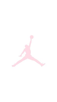 a person jumping up in the air with a basketball on their feet and one hand