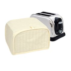 two toasters sitting next to each other on a white background