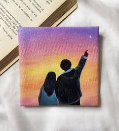 a painting of two people pointing at the sky with an open book in the background