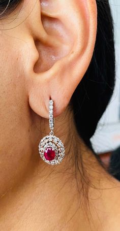 For Sale on 1stDibs - These stunners have 2 Natural Oval Cut Rubies that weigh 2.05 Carats. They are surrounded by 134 Round Cut Diamonds that weigh 1.50 Carats. (Clarity: VS2, Elegant Ruby Earrings Gia Certified, Luxury Oval Gia Certified Earrings, Gia Certified Drop Diamond Earrings For Formal Occasions, Formal Gia Certified Oval Earrings, Gia Certified Formal Drop Earrings, Gia Certified Diamond Drop Earrings, Gia Certified Dangle Earrings For Formal Events, Gia Certified Dangle Earrings For Formal Occasions, Formal Gia Certified Dangle Diamond Earrings