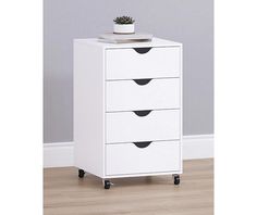 a white cabinet with three drawers and a plant on top