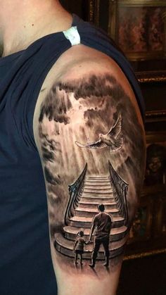 a man with a stairway tattoo on his arm