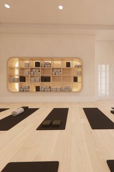 there is a yoga room with mats on the floor