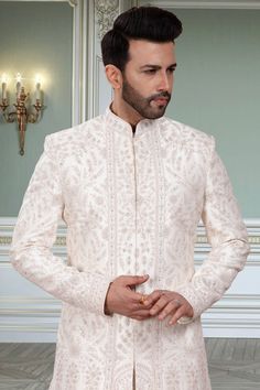 This men's sherwani, R14-S91, features a Double-layer design specifically crafted for grooms. The traditional thread embroidery and stone accents add an elegant touch to any wedding outfit. Experience the comfort and sophistication of this expertly crafted sherwani. Mens Sherwani, Thread Embroidery, Layer Design, Layers Design, This Man, Wedding Outfit, Double Layer, Thread, Embroidery