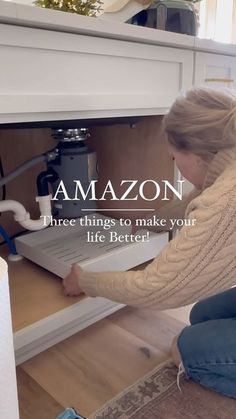 a woman kneeling down in front of an open drawer