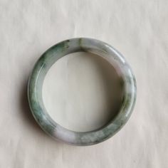 Certificate included. This bangle is 100% natural, untreated and undyed, grade-A jadeite jade and handmade. Beautiful natural looking created by Mother Nature makes this bangle absolutely unique and attractive. It has stone lines. Jadeite products may have stone lines and flaws such as small cracks, dents, and imperfect shaping, etc.. They're  handmade with pure natural material, so they could never be 100% perfect, thanks for understanding. Jadeite symbolizes good fortune, healthy and safety. I Handmade Round Jade Bangle, Jade Bangle, Natural Materials, Mother Nature, Jade, Bangle Bracelets, Floral Pattern, Jewelry Bracelets, Bangles