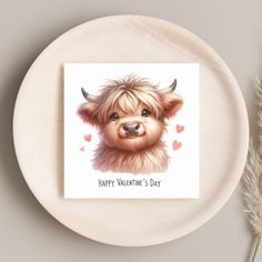 a white plate with a brown dog on it's side and a card that says happy valentine's day